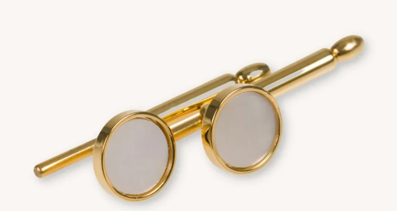 Bröstknappar guld pinne