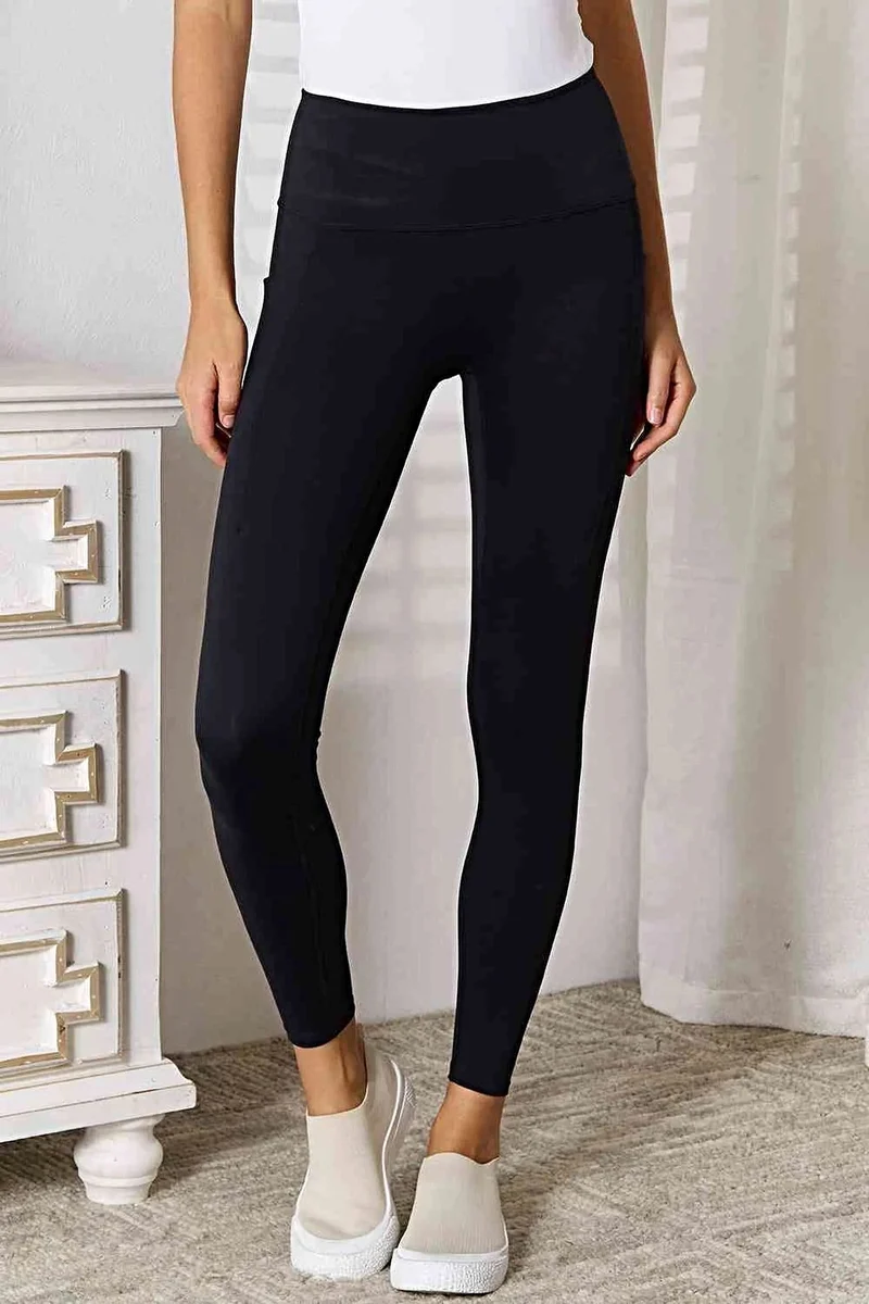Lyxiga sportleggings med bred midja och ficka, lätt stretchiga för optimal komfort
