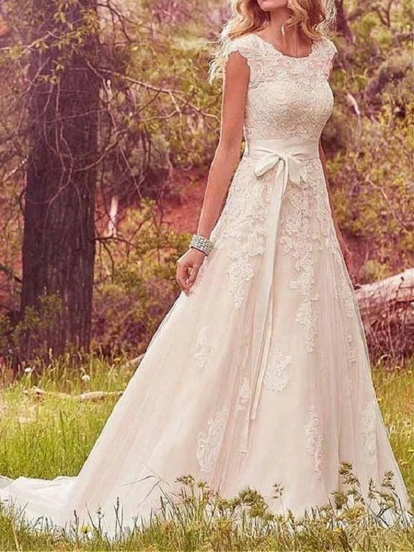 Bröllopsklänning i lantlig spets med kepsärmar | Vestido de Novia