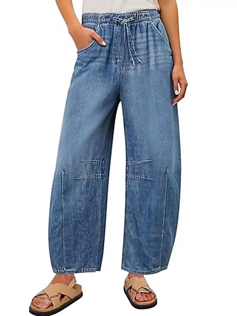Lyxiga jeans med elastisk midja, vida ben, dragsko och fickor