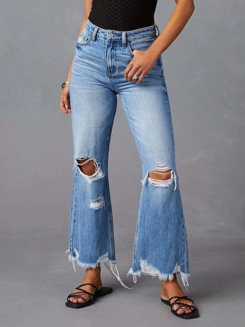 Slitna utsvängda jeans med rå fåll