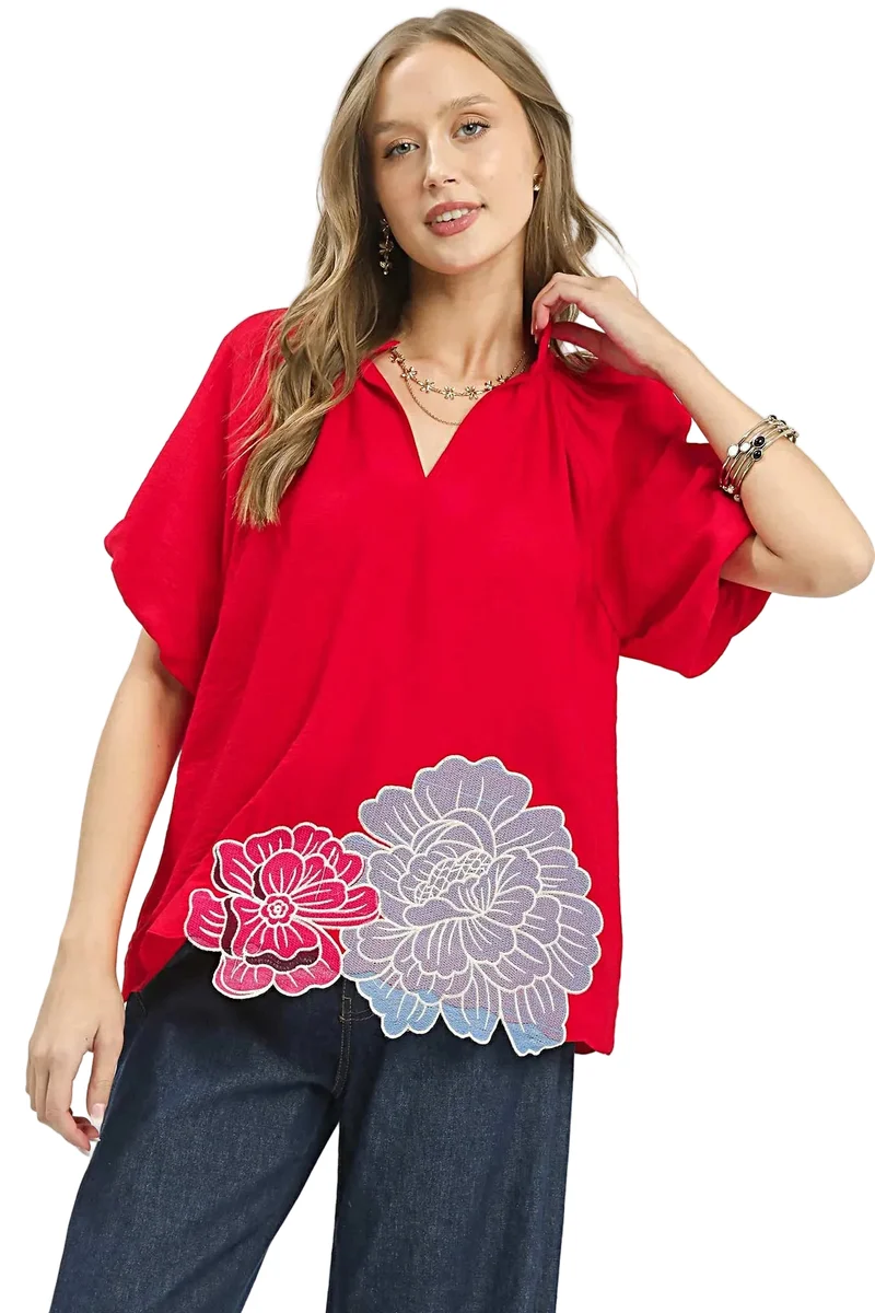 Blus med blommig broderi